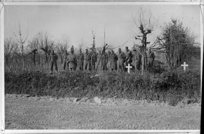 New Zealand soldiers at a graveside service, near Faenza, Italy, during World War 2