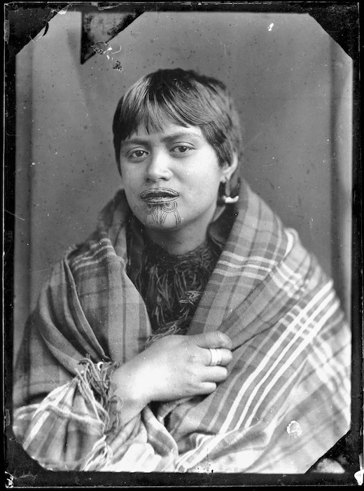 Unidentified Maori woman wrapped in a blanket