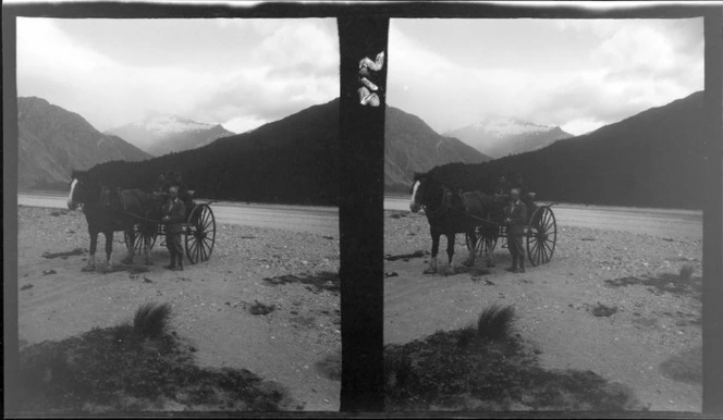 Edgar Williams' Mount Aspiring trip, three unidentified men with a horse drawn buggy in front of the West Matukituki River with snow covered mountains beyond, Central Otago Region