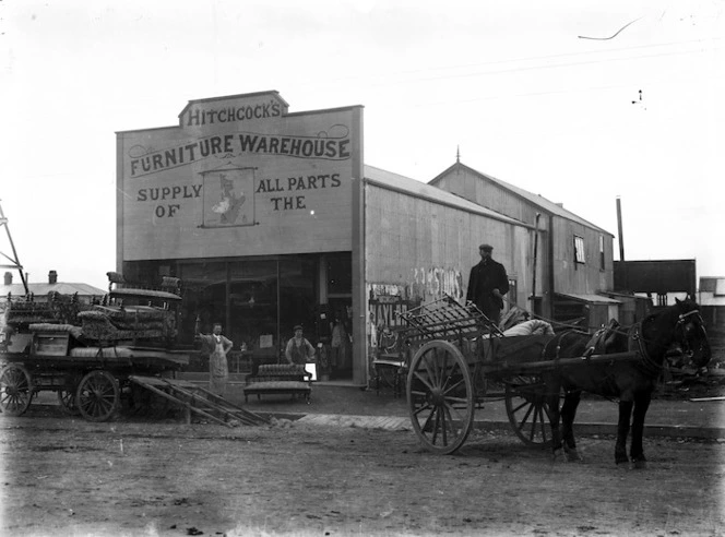 Premises of Hitchcock's Furniture Warehouse, with carts loaded with furniture alongside