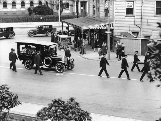 Raine, William Hall, 1892-1955 (Photographer) : Funeral procession with hearse, Bowen Street, Wellington