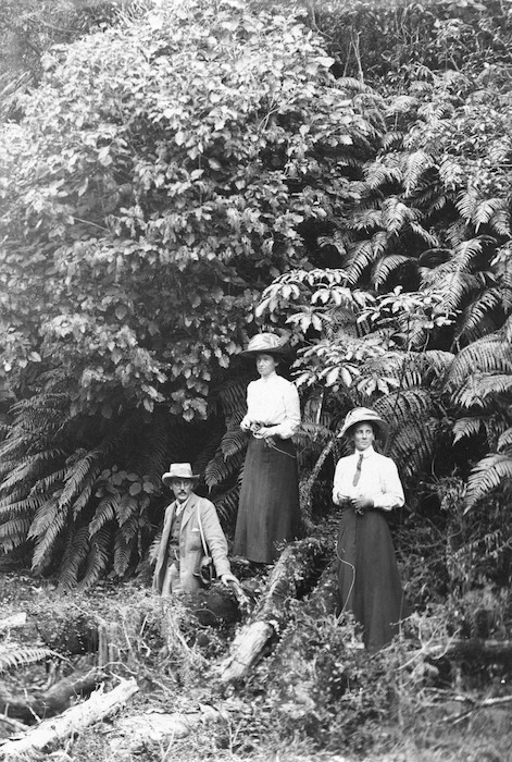Frank and Amy Hutchinson, with Jerome Spencer, alongside some native bush
