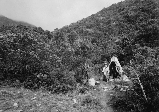 May Kinsey outside her tent near The Hermitage, Mount Cook