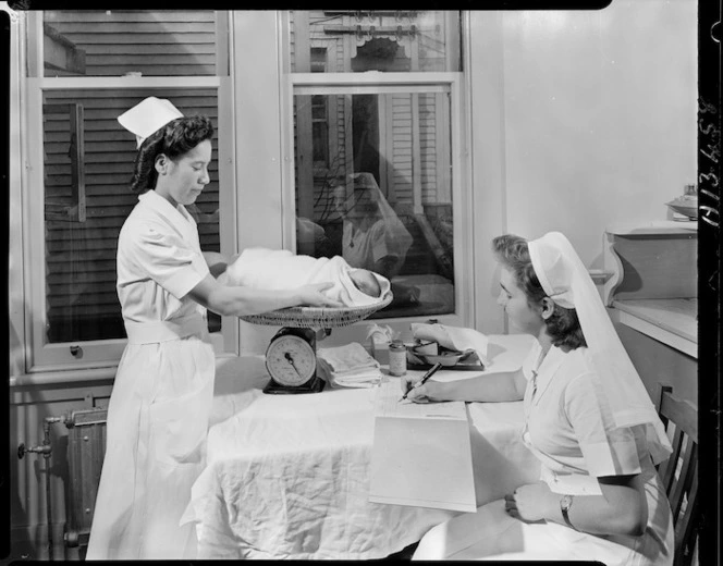 Nurse weighing a baby, Memorial Hospital, Kaitaia - Photograph taken by Edward Percival Christensen