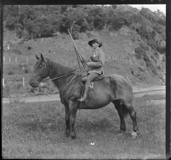 Unidentified man in uniform on a horse, unknown location