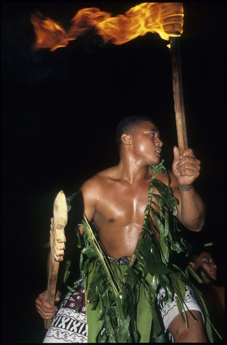 War dancer with flaming torch during the opening dance of the 7th Festival of Pacific Arts in Apia, Samoa