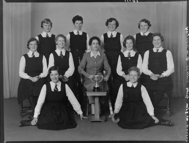 Wellington Girls' College 1st XI hockey team with trophy