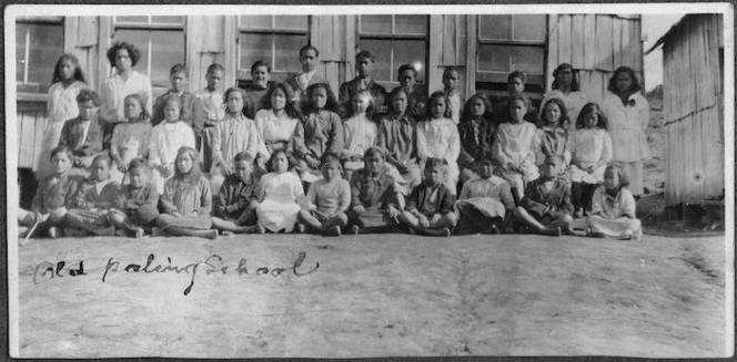 Maori school children outside the first paling school at Ruatahuna