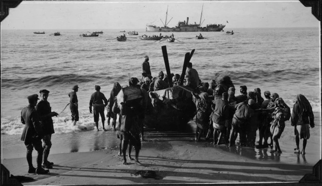 Arabs landing British Army stores by boat, Palestine.