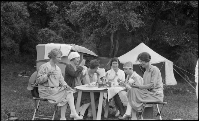 Group of women having breakfast on a camping trip