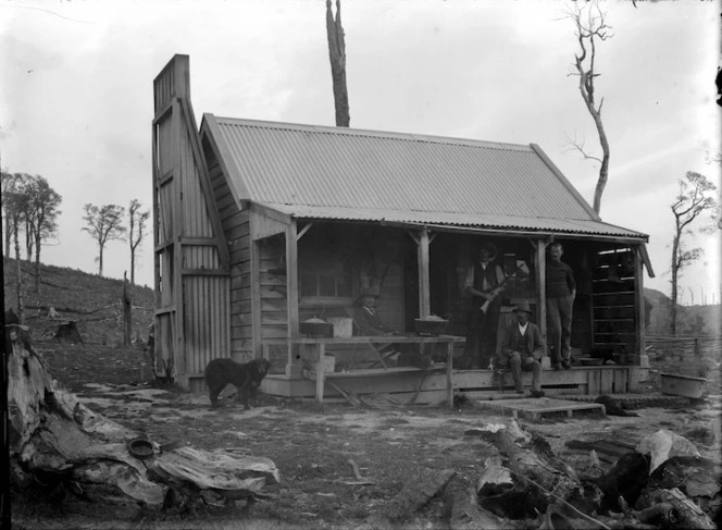 Hut, men and dog