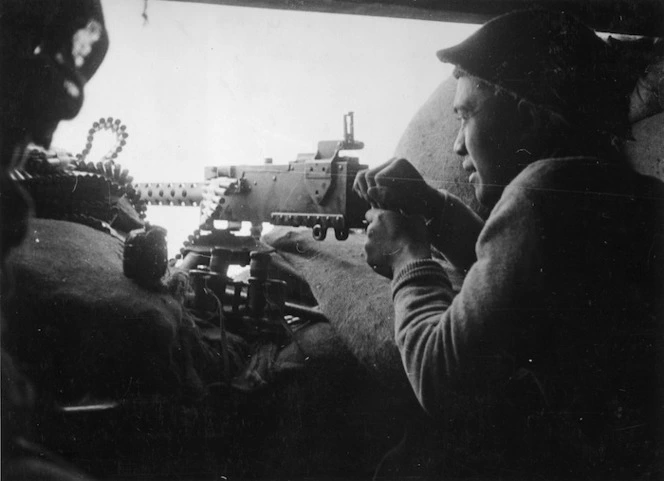 Private Nepia of the Maori Battalion firing his Browning machine gun 300 yards from the Senio River - Photograph taken by J Short