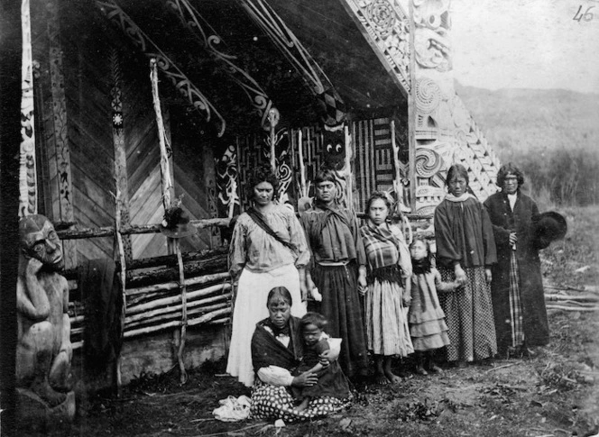 Unidentified group alongside the Te Tokanganui-A-Noho meeting house in Te Kuiti