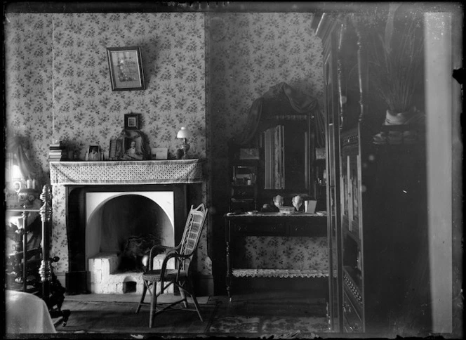 Interior view of a bedroom, circa 1900