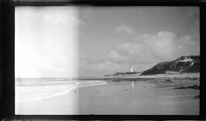 Beach and lighthouse at Waipapa Point