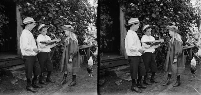 Edgar and Owen Williams and Edith Kenworth inspect a Nikau palm flower bud