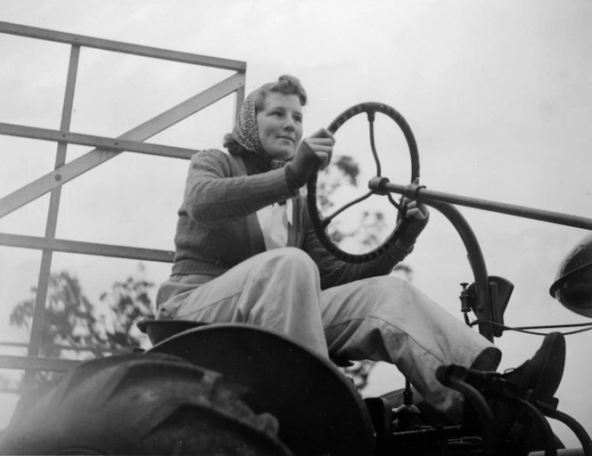 A female linen flax worker driving a tractor in Geraldine