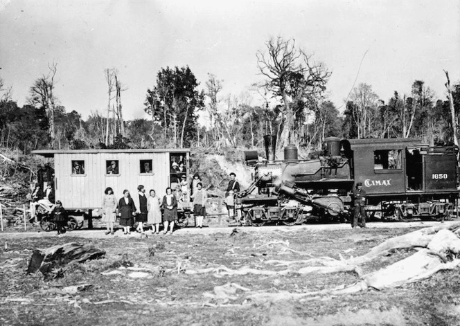 Picnic party alongside Climax locomotive 1650 at Ongarue