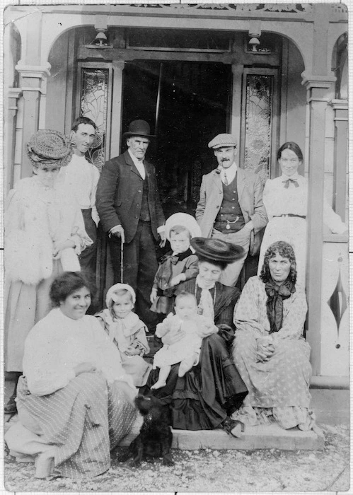 Bevan family on the verandah of the family home, Munga Huia, Manakau