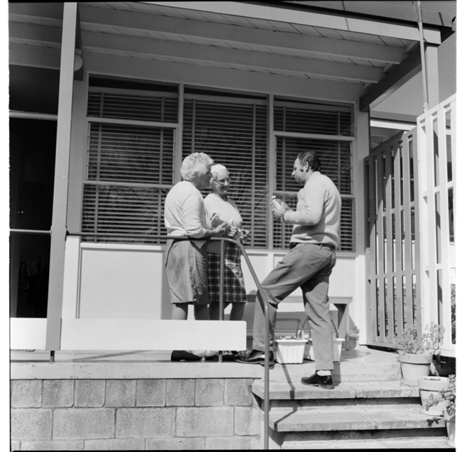 Visiting salesman at pensioners flats, Beresford Street area, Ponsonby, Auckland