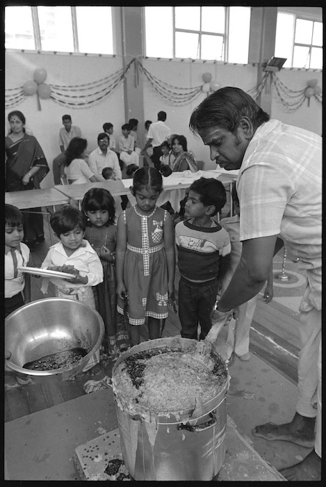 Thurairatnam Sivasakthivel preparing rice pudding for the Tamil Harvest Festival, Wellington - Photograph taken by John Nicholson