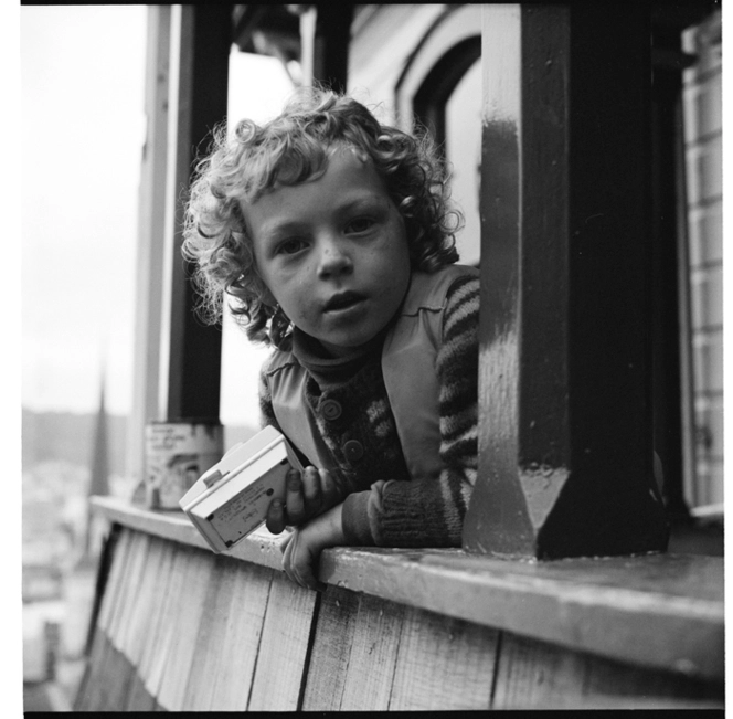 Woman and children in a house, possibly by the Dixon Street steps, Wellington