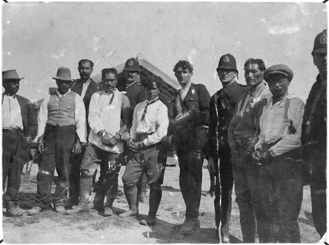 Rua Kenana Hepetipa and his son Whatu, handcuffed