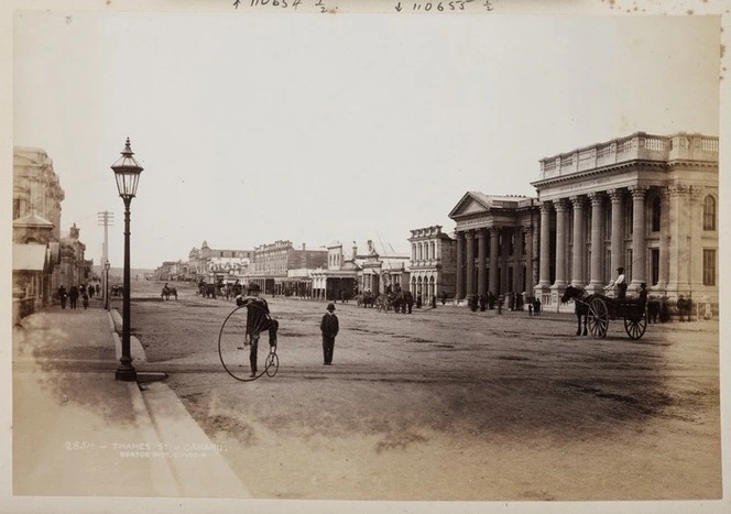 Penny farthing bicycle and carriages in Thames St, Oamaru