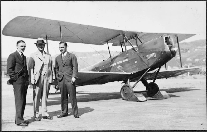 Guy Menzies and two other men with "Southern Cross Junior"