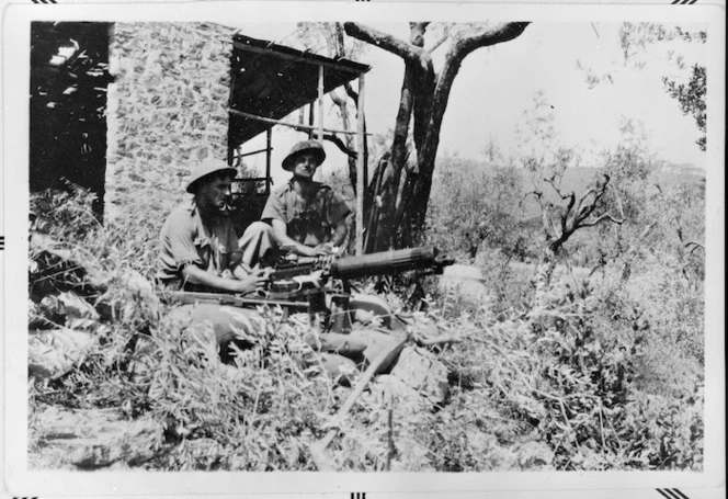 Corporal McKenzie and Sergeant Brown of Three Platoon, in their last position before the fall of Florence, Italy