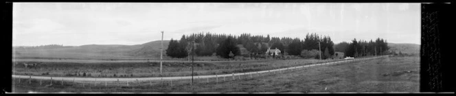 Farmhouse across road, in Southland