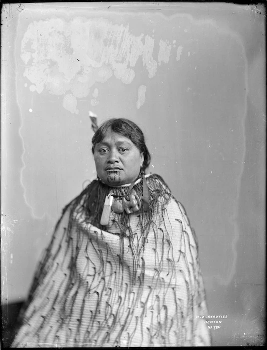 Unidentified Maori woman wearing a tag cloak - Photograph taken by Frank J Denton