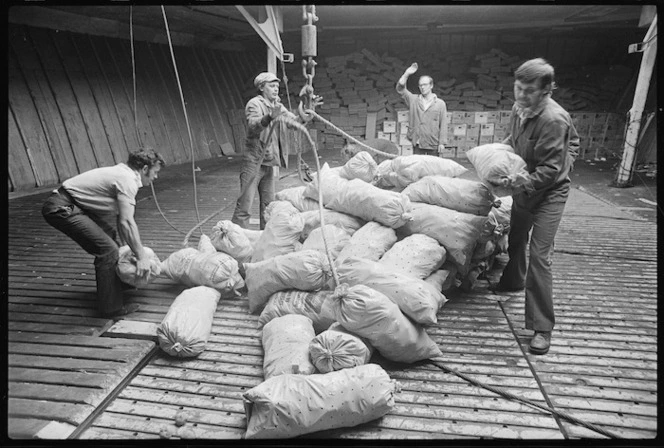 Crew members of the Russian ship Ostrov Ushakova loading bags of potatoes into one of the ship's refrigerated holds - Photograph taken by Alan Stevenson