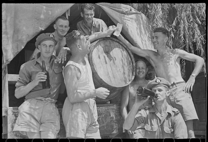 New Zealanders grouped about a cask of wine at the 24 Battalion swimming sports in Arce, Italy - Photograph taken by George Frederick Kaye