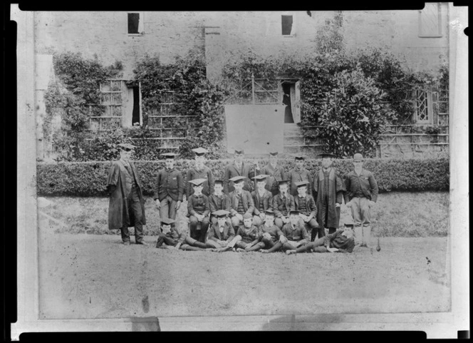 Group portrait of students and teachers in academic dress, including trenchers, at King's College, Remuera, Auckland