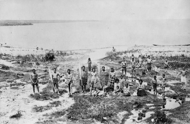 Deveril, Herbert, 1840-1911 :Maori group of men, women and children on the shores of Lake Taupo