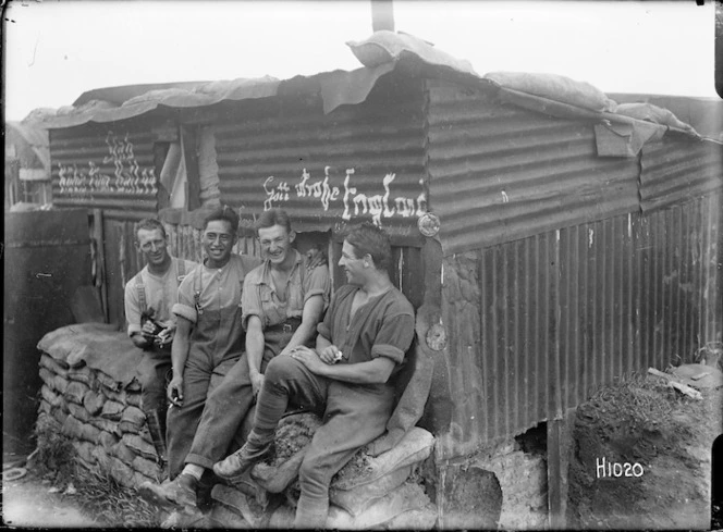 New Zealand soldiers outside a captured German hut