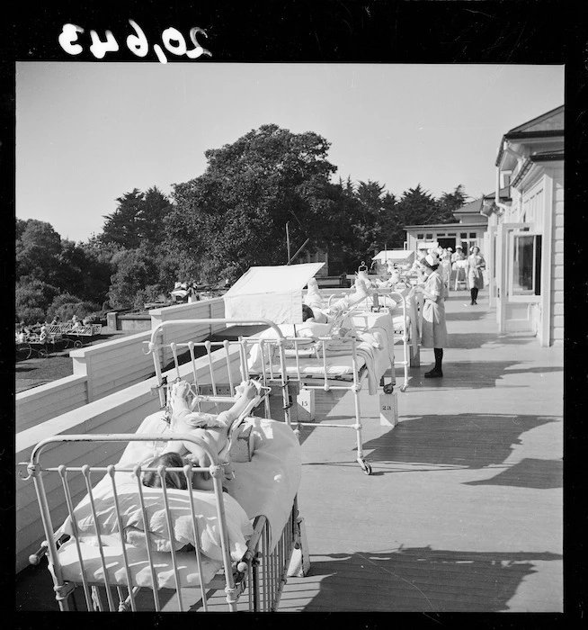 Children lying their beds in the solarium at the Wilson Home for crippled children in Takapuna, Auckland