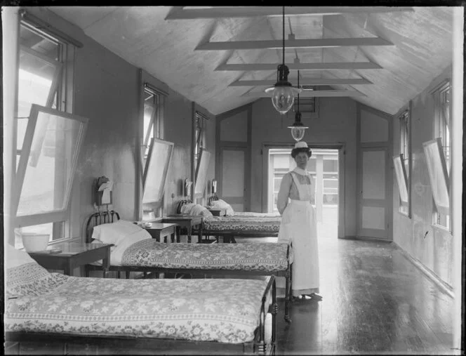 Hospital interior with nurse and beds