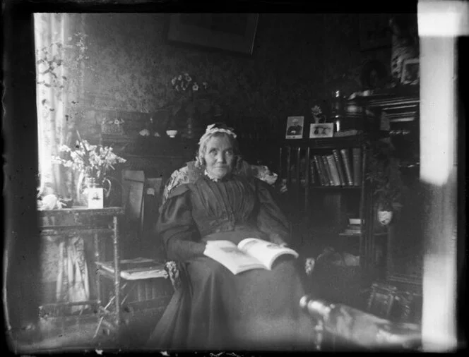 Sarah Jane Kirk reading in sitting room