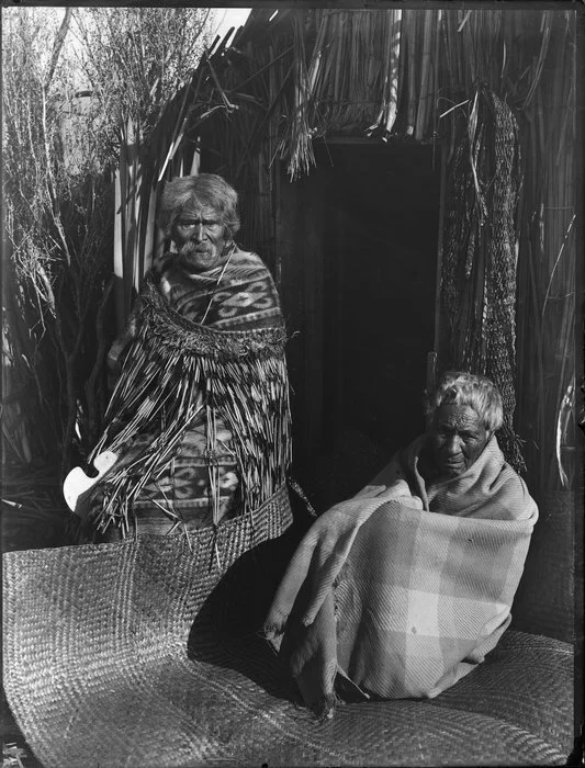 Unidentified kaumatua and kuia, Maori man and woman, whare location unknown