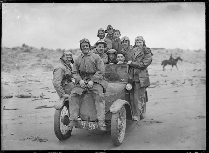 Men on a Austin car