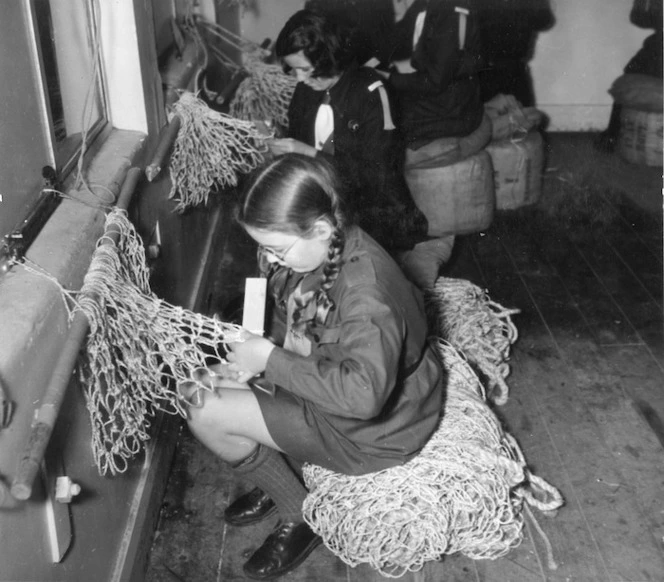 Girl Guides making camouflage nets