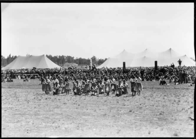 Maori women performing in field