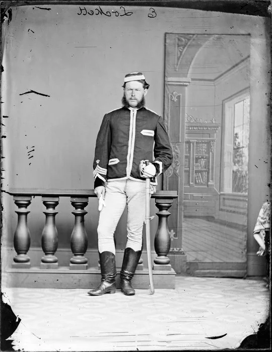 Mr E Lockett, in military uniform, with sabre