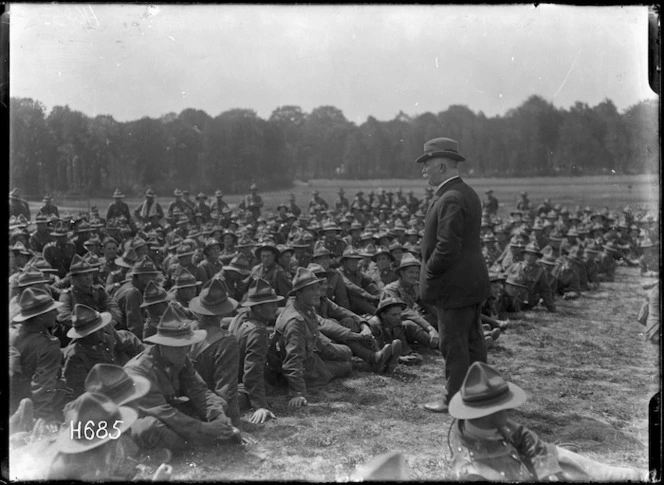 Prime Minister William Massey addressing New Zealand machine gunners at Bois-De-Warnimont, France, during World War 1