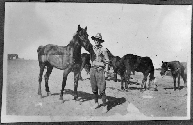 Unidentified soldier and a horse named "Bones."