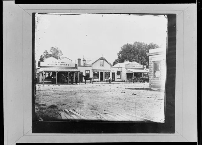 Hawera, Taranaki, street scene, including Max D King's Regent House, and the business premises of H G Pitcher - Photograph taken by Collis