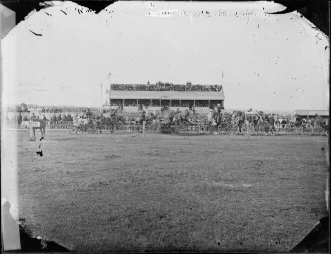 Race meeting at Whanganui with stand and carriages