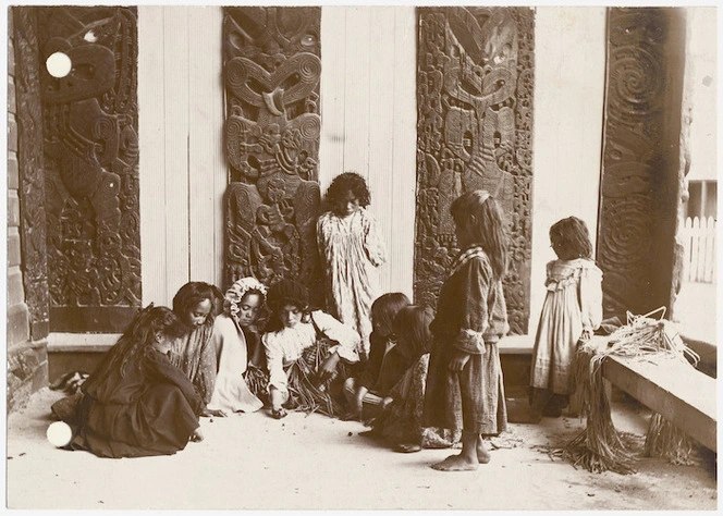 Children playing inside the Tamatekapua meeting house at Ohinemutu
